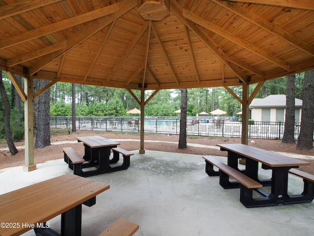 view of community with a patio area and fence