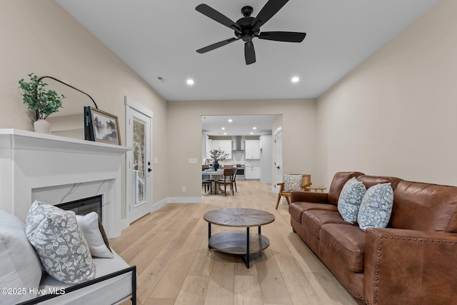 44 S Shamrock Dr, Foxfire Village, NC 27281 - living room with recessed lighting, light wood-type flooring, a ceiling fan, a fireplace, and baseboards