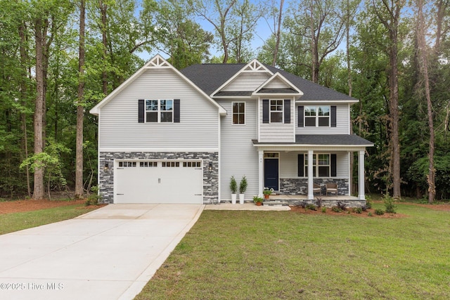 44 S Shamrock Dr, Foxfire Village, NC 27281 - craftsman inspired home featuring covered porch, driveway, a front yard, an attached garage, and stone siding