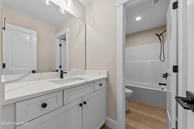 44 S Shamrock Dr, Foxfire Village, NC 27281 - bathroom with wood finished floors, toilet, vanity, and washtub / shower combination