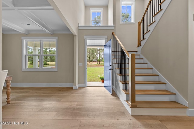 44 S Shamrock Dr, Foxfire Village, NC 27281 - foyer entrance with hardwood / wood-style flooring, stairs, beam ceiling, crown molding, and baseboards