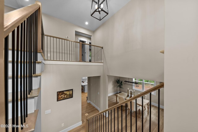 44 S Shamrock Dr, Foxfire Village, NC 27281 - stairway featuring wood finished floors, baseboards, recessed lighting, and a towering ceiling