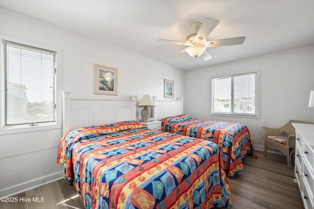 bedroom with ornamental molding and ceiling fan