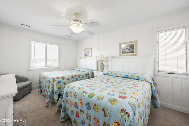 bedroom featuring ceiling fan and visible vents