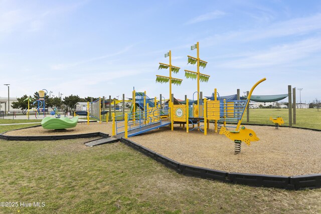 community play area featuring a lawn