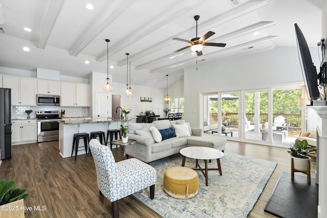 living room with ceiling fan, beam ceiling, high vaulted ceiling, recessed lighting, and dark wood-style floors