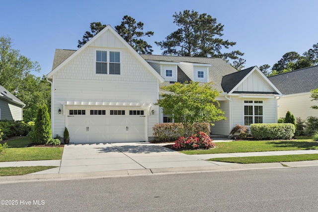 view of front of house featuring board and batten siding, an attached garage, driveway, and roof with shingles