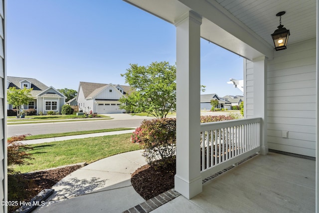 view of patio / terrace featuring covered porch and a residential view