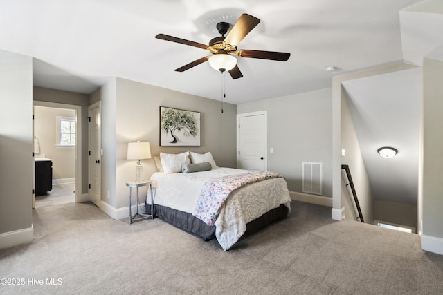 bedroom with light colored carpet, baseboards, ceiling fan, and visible vents