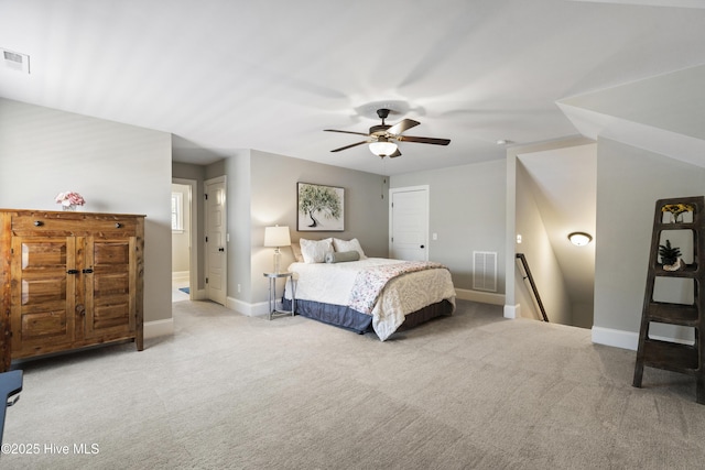 bedroom with carpet floors, a ceiling fan, baseboards, and visible vents