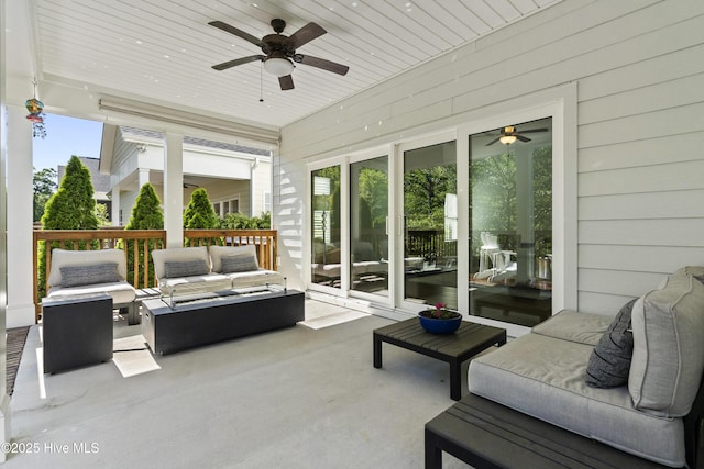 sunroom / solarium with ceiling fan and outdoor lounge area