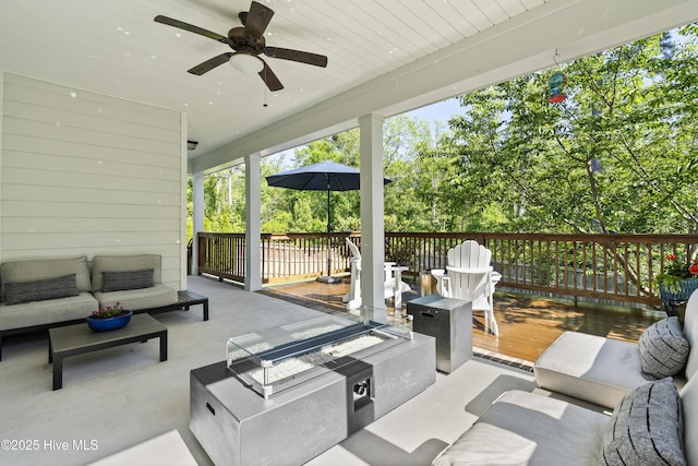 view of patio / terrace featuring an outdoor hangout area, a ceiling fan, and a deck