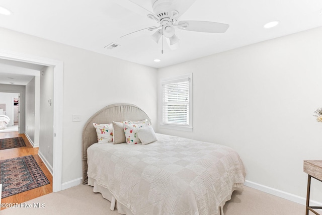 bedroom with baseboards, a ceiling fan, recessed lighting, and visible vents
