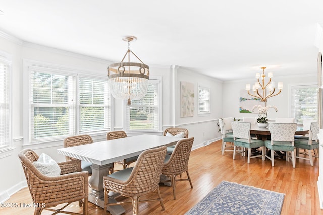 dining space featuring a chandelier, a healthy amount of sunlight, and light wood-style floors