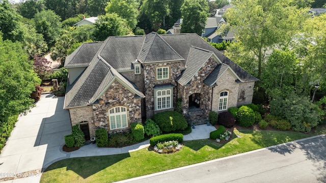 2220 Bel Arbor Pl, Wilmington, NC 28403 - french provincial home featuring stone siding and a front lawn
