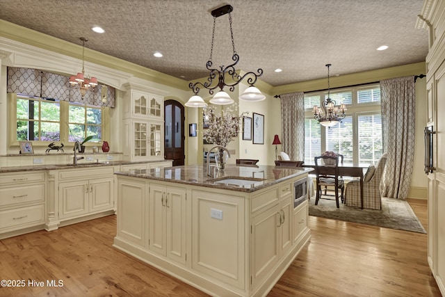 2220 Bel Arbor Pl, Wilmington, NC 28403 - kitchen with a chandelier, stainless steel microwave, plenty of natural light, and recessed lighting