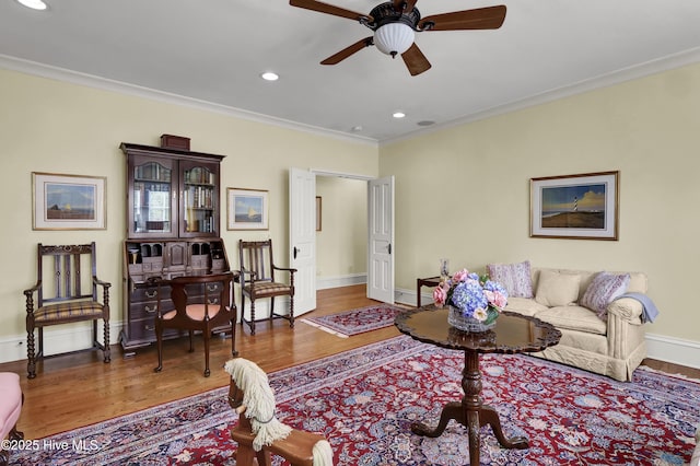 2220 Bel Arbor Pl, Wilmington, NC 28403 - living area featuring crown molding, wood finished floors, a ceiling fan, and recessed lighting