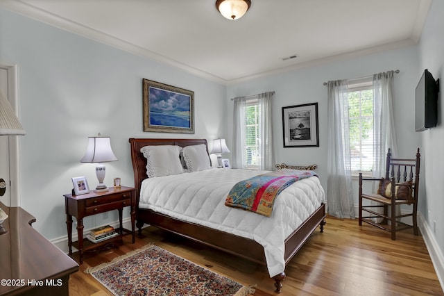 2220 Bel Arbor Pl, Wilmington, NC 28403 - bedroom featuring ornamental molding and wood finished floors