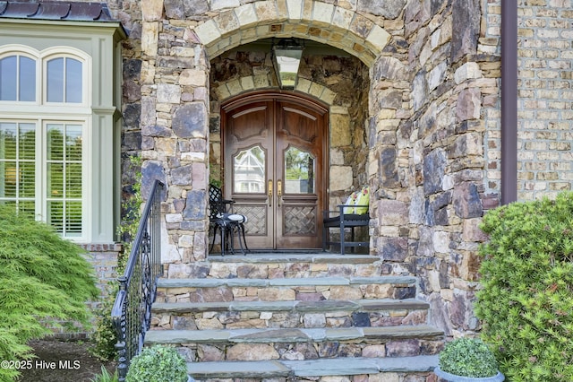 2220 Bel Arbor Pl, Wilmington, NC 28403 - entrance to property with french doors, stone siding, and brick siding
