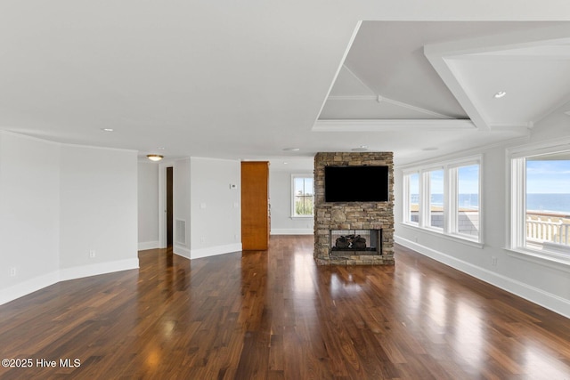 805 S Lumina Ave, Wrightsville Beach, NC 28480 - unfurnished living room with baseboards, ornamental molding, a fireplace, and dark wood-style floors