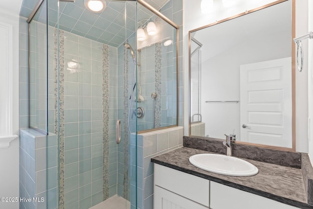 805 S Lumina Ave, Wrightsville Beach, NC 28480 - bathroom featuring vanity and a shower stall