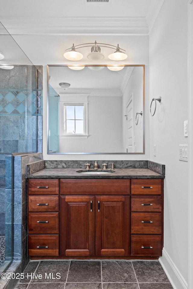 805 S Lumina Ave, Wrightsville Beach, NC 28480 - bathroom with crown molding, visible vents, baseboards, a shower stall, and vanity