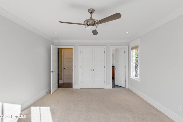 805 S Lumina Ave, Wrightsville Beach, NC 28480 - unfurnished bedroom with baseboards, carpet flooring, a closet, and ornamental molding