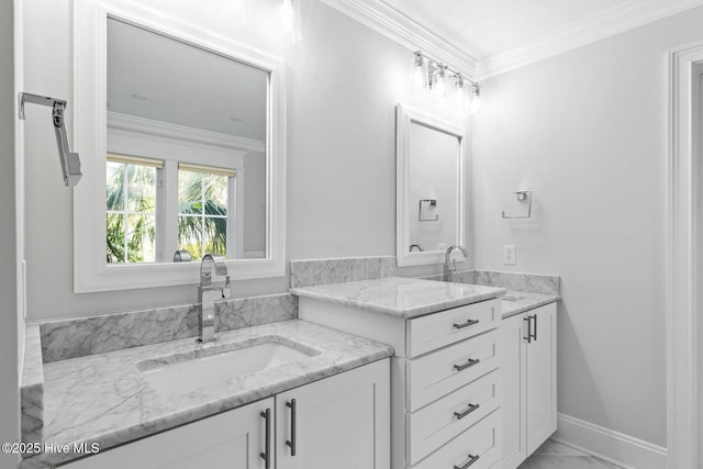 805 S Lumina Ave, Wrightsville Beach, NC 28480 - bathroom featuring two vanities, marble finish floor, crown molding, and a sink