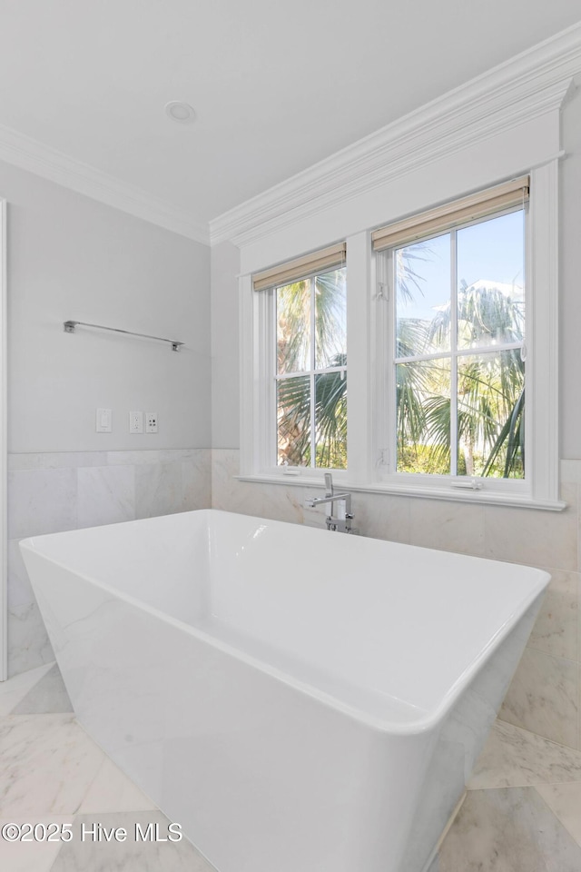 805 S Lumina Ave, Wrightsville Beach, NC 28480 - full bath with ornamental molding, tile walls, a wealth of natural light, and marble finish floor