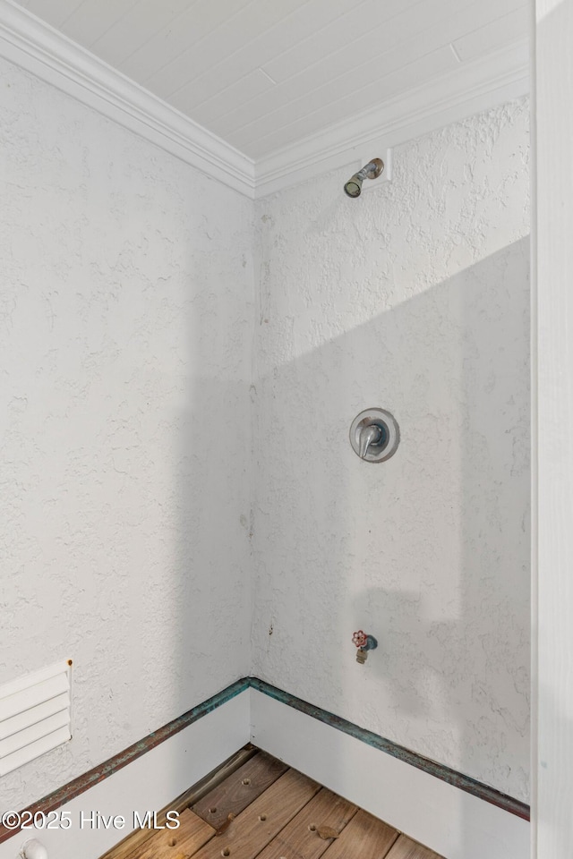 805 S Lumina Ave, Wrightsville Beach, NC 28480 - bathroom featuring wood finished floors and ornamental molding