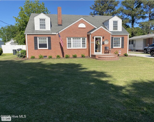 612 Blaney St, Clinton, NC 28328 - new england style home featuring brick siding, a front yard, and a chimney