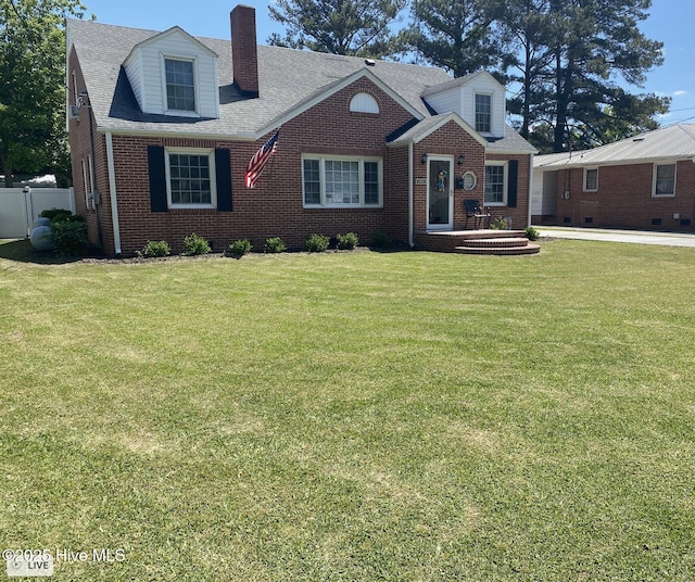 612 Blaney St, Clinton, NC 28328 - cape cod house with brick siding, fence, a chimney, and a front lawn
