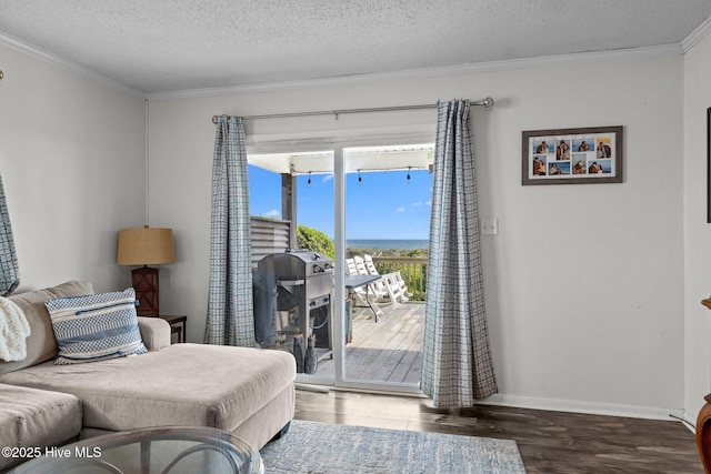 415 W Boardwalk Blvd, Atlantic Beach, NC 28512 - living area featuring wood finished floors, ornamental molding, a textured ceiling, and baseboards