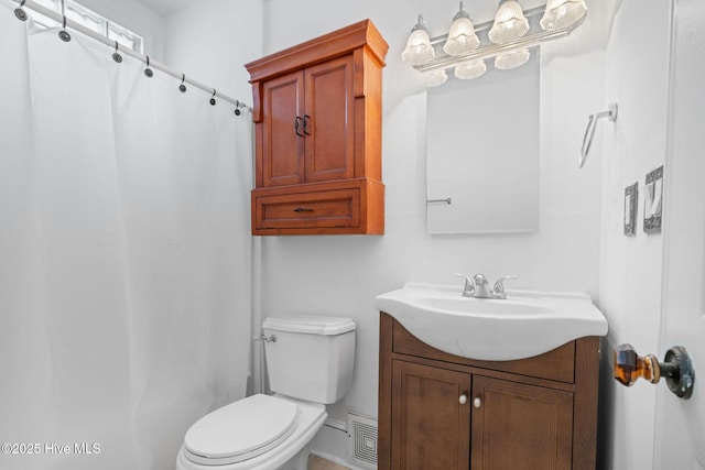 bathroom with vanity, toilet, and a shower with shower curtain