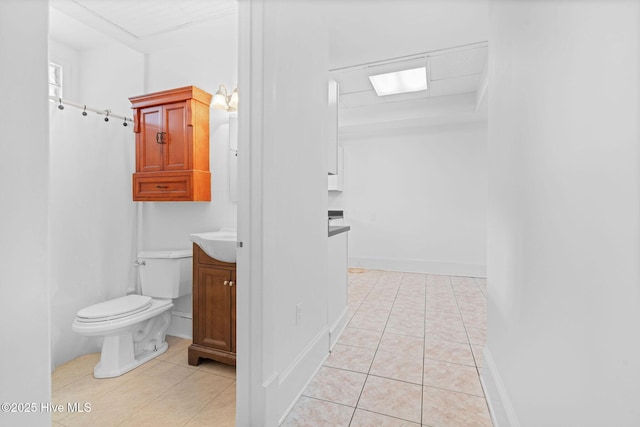 bathroom featuring toilet, tile patterned floors, a shower with curtain, and vanity