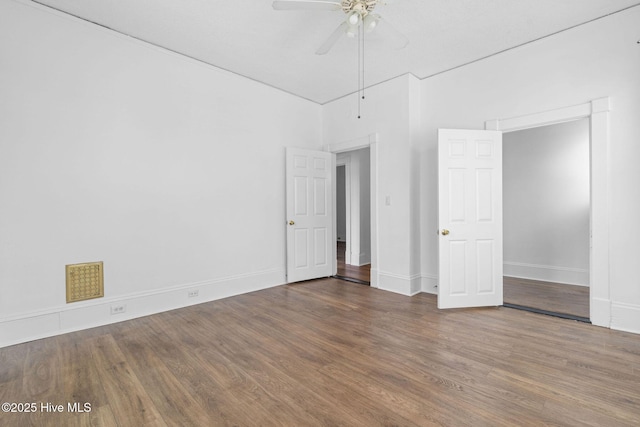 unfurnished bedroom with baseboards, ceiling fan, and wood finished floors