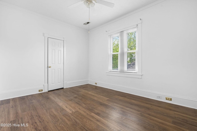 unfurnished room featuring a ceiling fan, visible vents, ornamental molding, and wood finished floors