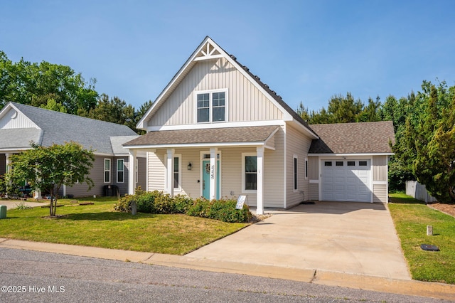 view of front of house with an attached garage, a front lawn, board and batten siding, a porch, and concrete driveway