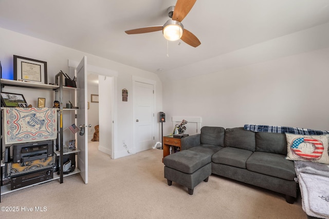 carpeted living room with baseboards and ceiling fan
