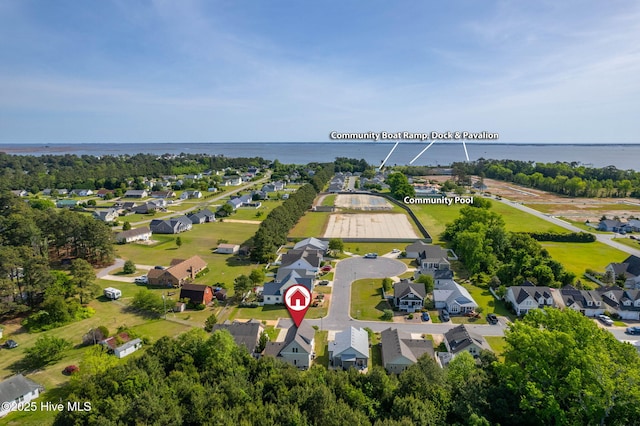 drone / aerial view with a water view and a residential view