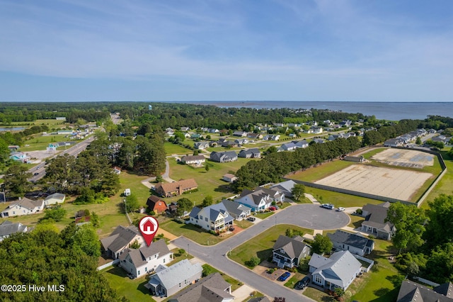 drone / aerial view featuring a water view and a residential view