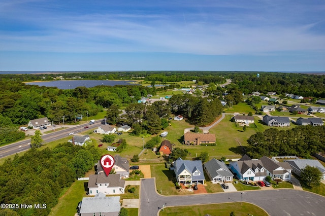 birds eye view of property with a water view and a residential view