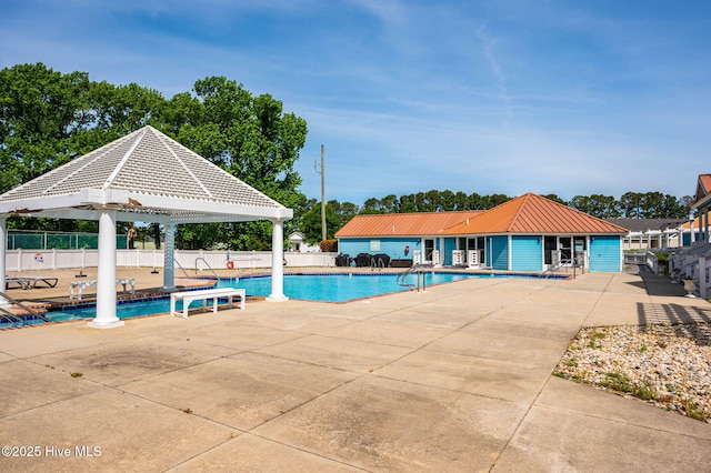 pool featuring a patio and fence