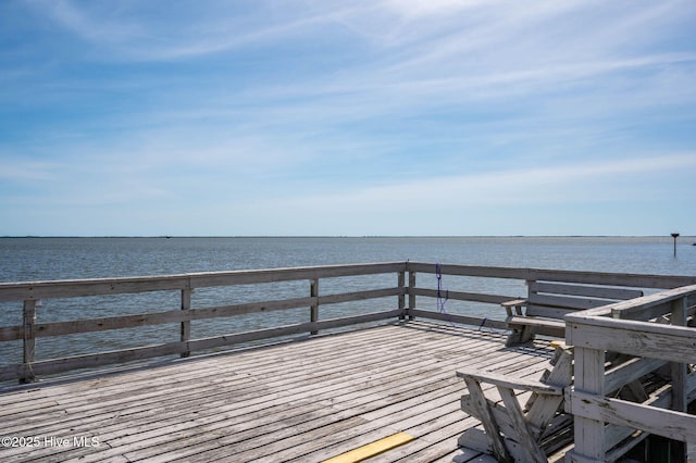 view of dock with a deck with water view