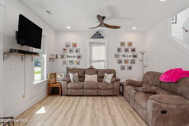 living area with recessed lighting, ceiling fan, light wood finished floors, and a wealth of natural light