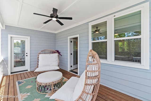 wooden terrace featuring ceiling fan