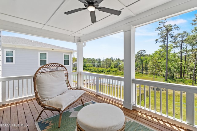 wooden terrace featuring ceiling fan
