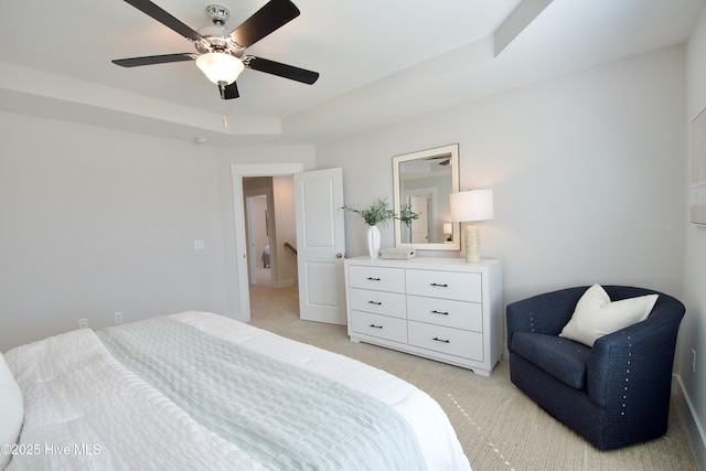 218 Country Club Dr SW, Shallotte, NC 28470 - bedroom featuring a ceiling fan, a raised ceiling, and light carpet