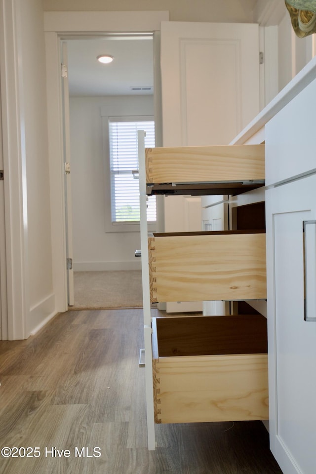 218 Country Club Dr SW, Shallotte, NC 28470 - unfurnished bedroom with baseboards and wood finished floors