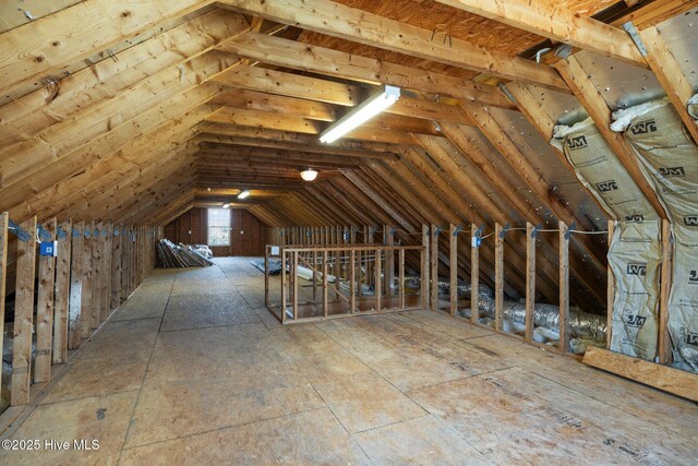 attic featuring an upstairs landing